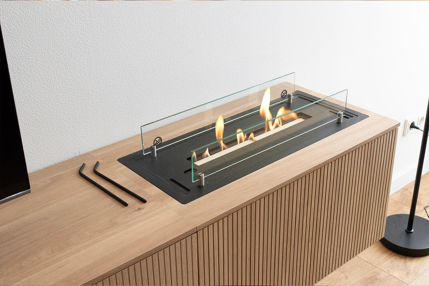 Bioethanol fireplace in a piece of furniture